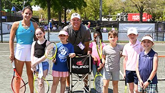 Tennis star Emma Navarro posing with students from Meeting Street Academy for ‘Number One Fan’ initiative at Credit One Charleston Open