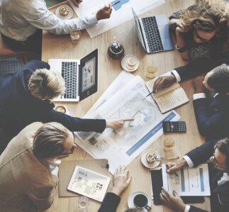 Colleagues collaborating around a desk