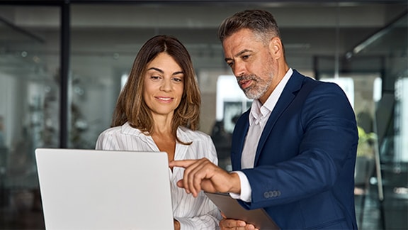 Team of confident professional business people work together.