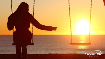 Woman on swings contemplating the loss of a loved one