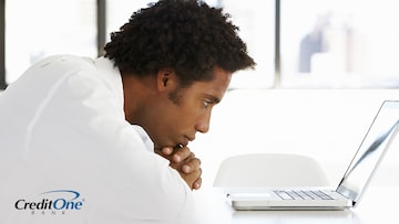 Man checking his credit report regularly