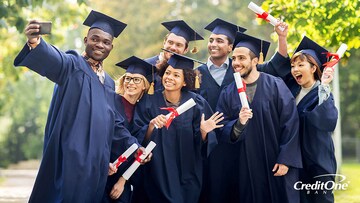 Recent college grads posing for a photo