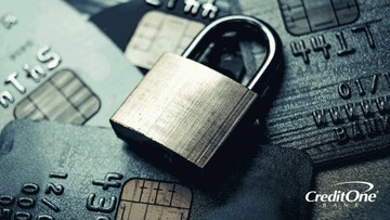 A lock sits on a pile of credit cards to represent secured credit cards.