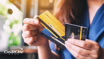 Close up of woman choosing a payment card to use.