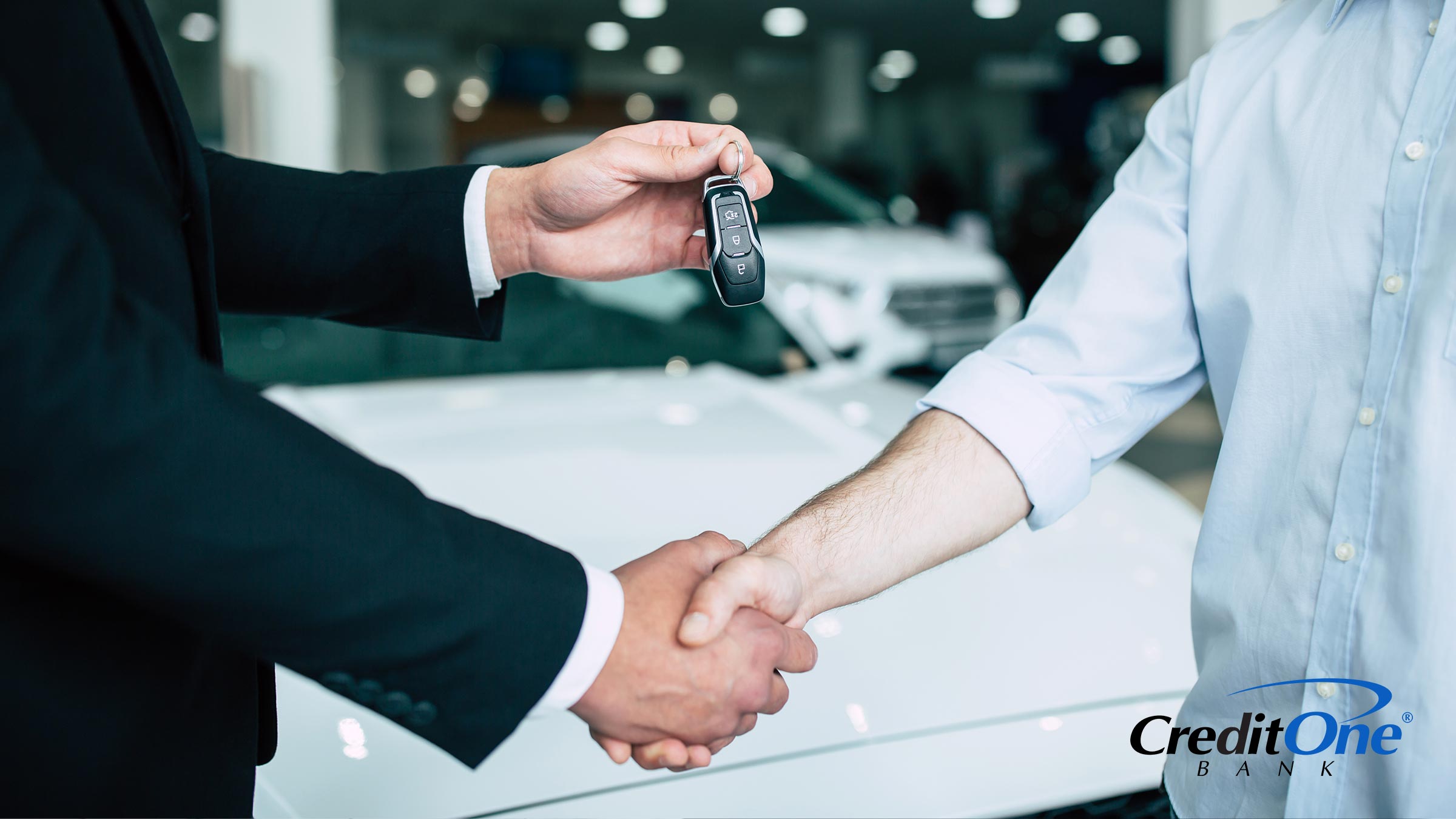 Handing the keys over to a newly purchased car.