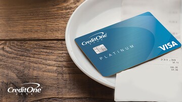 Credit card placed on top of dining receipt