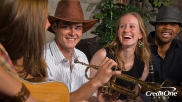 Musicians jam at a Nashville honky tonk, which you can enjoy for free on a budget travel vacation