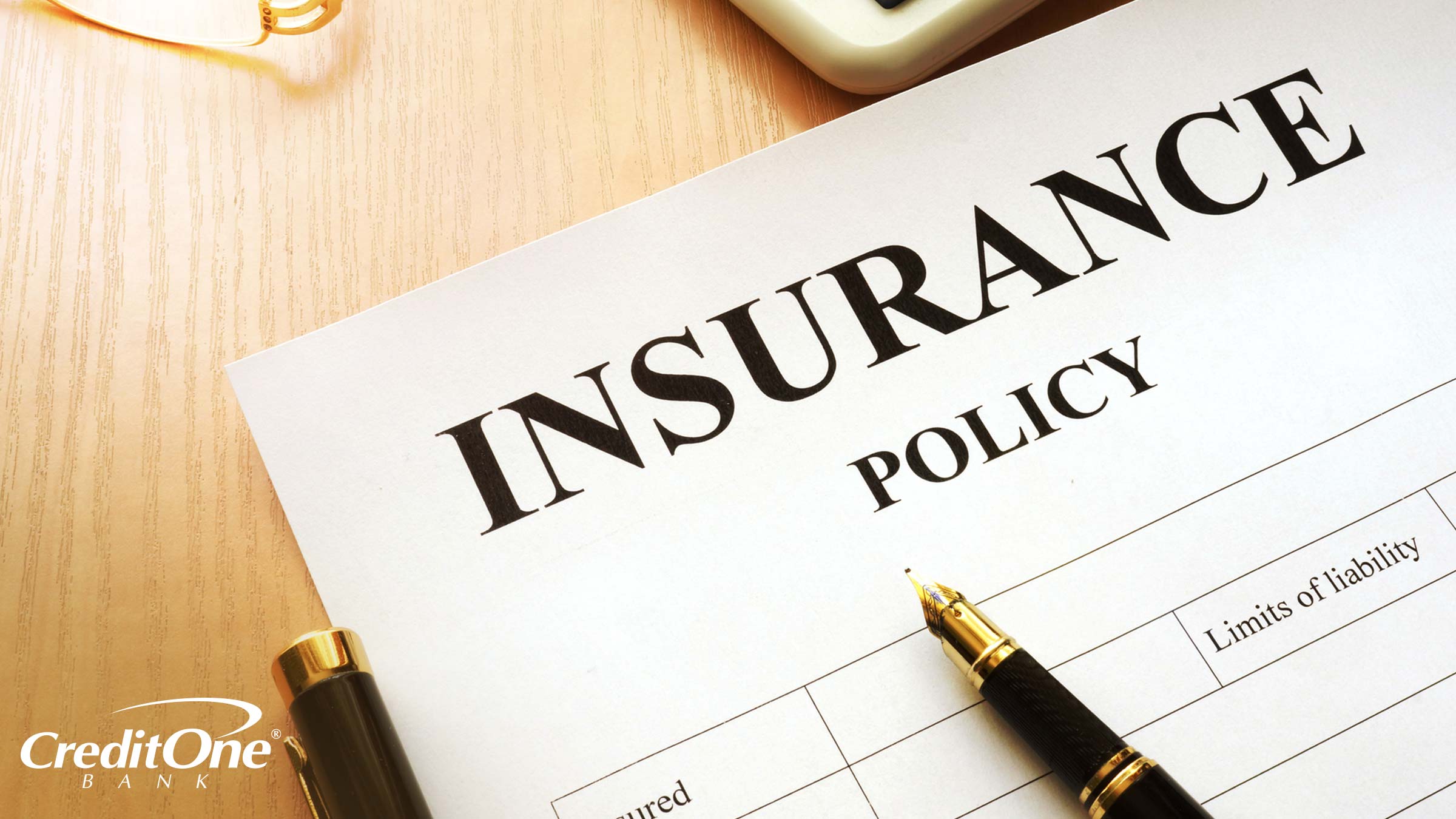An insurance policy on a desk outlines the insured, limits of liability, and other terms you should know