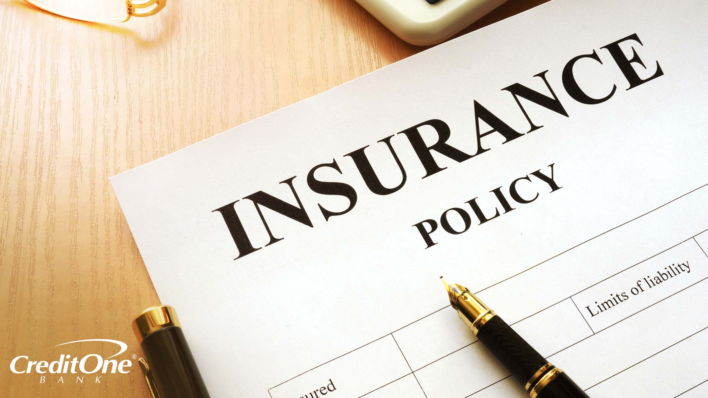 An insurance policy on a desk outlines the insured, limits of liability, and other terms you should know