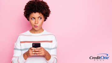 A woman on her mobile phone makes a ponderous expression, wondering if it is possible to use buy now, pay later with bad credit 
