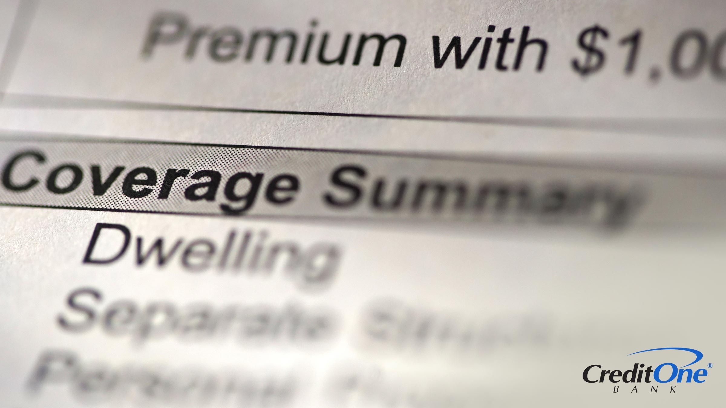 A close up shot of an insurance bill, with most of it blurry except for the word “coverage,” signifying the coverage limit for the insurance plan.