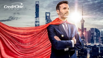 A business man with a superhero’s cape looks over the city as he considers his financial planning journey.
