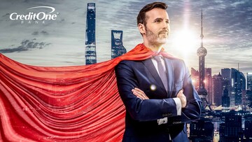 A business man with a superhero’s cape looks over the city as he considers his financial planning journey.