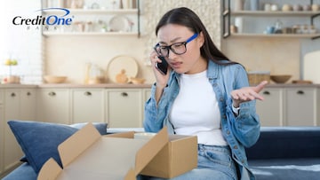 A woman complains with a merchant on the phone after receiving a damaged item in the mail, asking how to get a refund since she used her credit card.