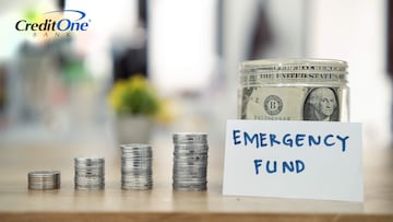 Four stacks of coins, each larger than the last, lead up to a jar labeled “Emergency Fund” with paper bills inside. This represents how saving a little bit of money at a time can gradually grow into a healthy emergency fund.