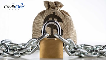A chain and padlock are wrapped around a burlap bag with a dollar sign on it, representing the concept of locked fixed-term savings accounts.