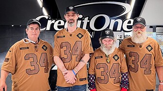 Four veterans from U.S.VETS – Las Vegas enjoy a Raiders game through Credit One Bank’s Number One Fan program.