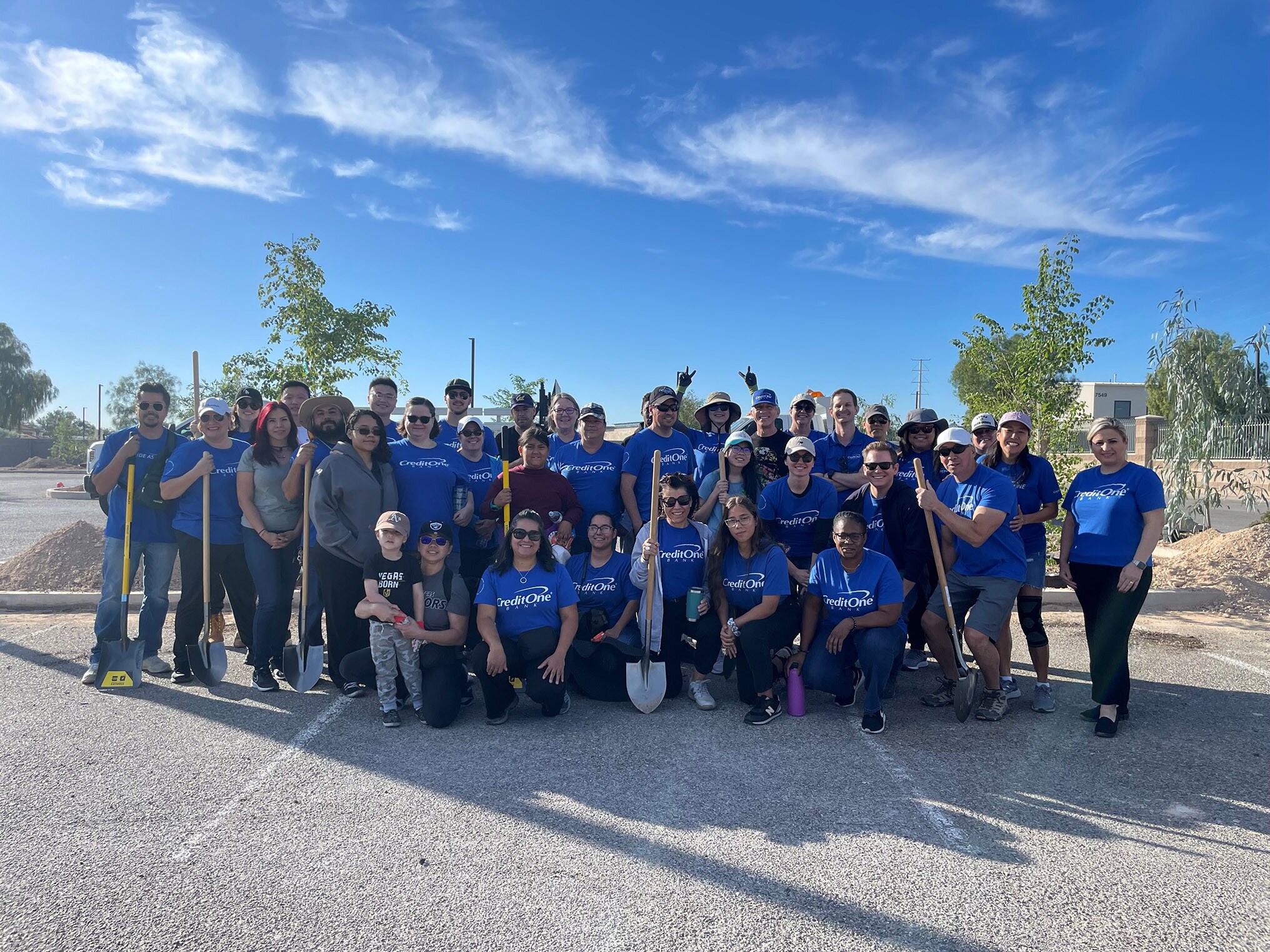 Credit One Bank employees at tree-planting event with Arbor Day Foundation