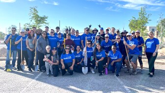 Credit One Bank employees at tree-planting event with Arbor Day Foundation