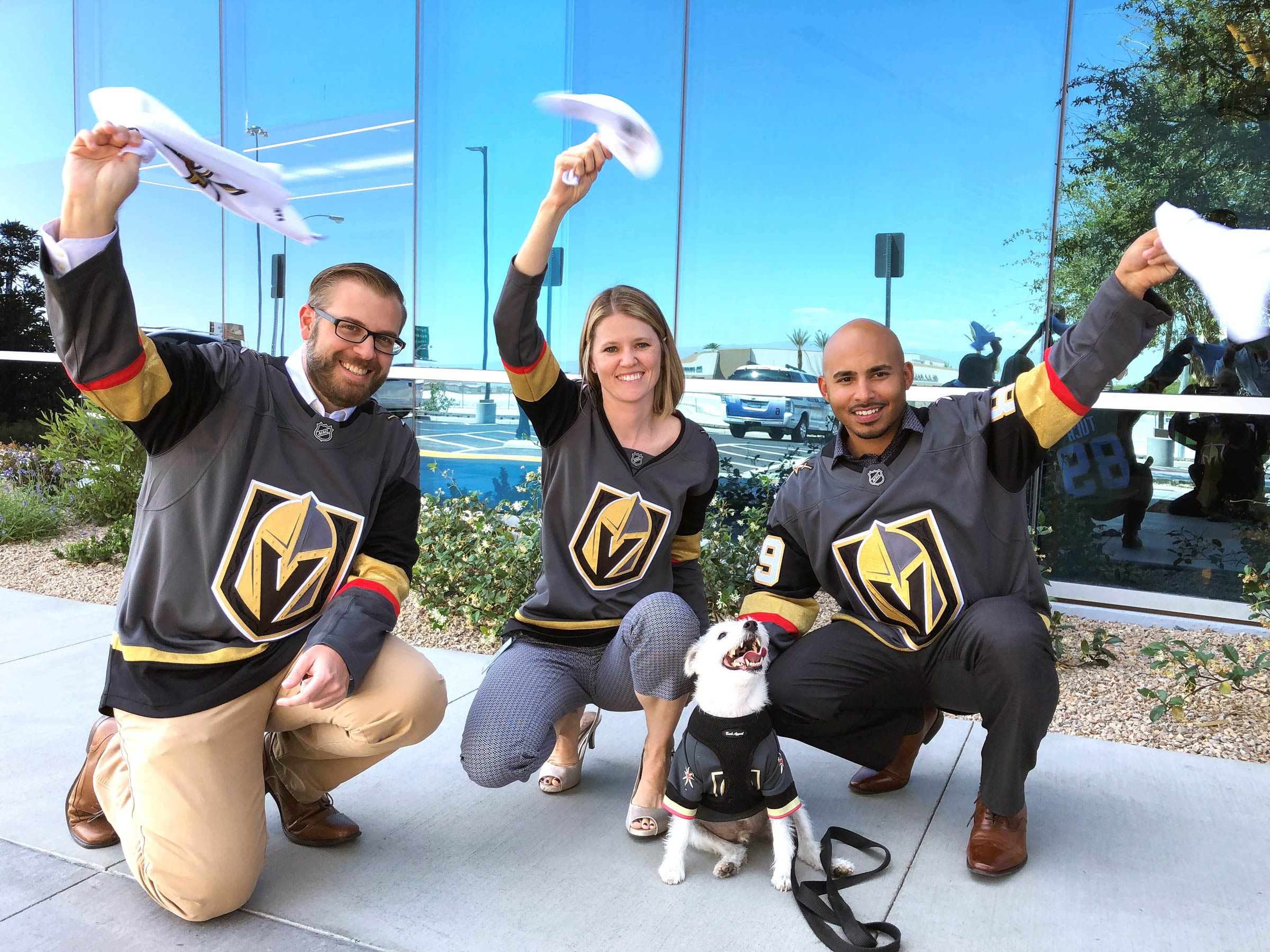 alt="Credit One Bank and Vegas Golden Knights Foundation members pose in Vegas Golden Knights jerseys"