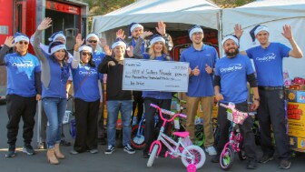 Credit One Bank employees at the 25th annual 98.5 KLUC Chet Buchanan Show Toy Drive