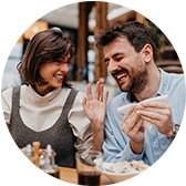 Woman and Man Eating at a Restaurant