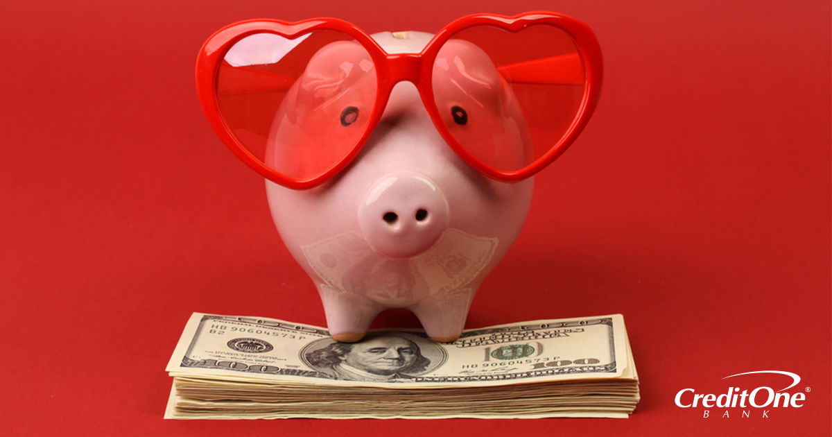 A ceramic piggy bank with heart-shaped glasses sitting on a pile of money A ceramic piggy bank with heart-shaped glasses sitting on a pile of money