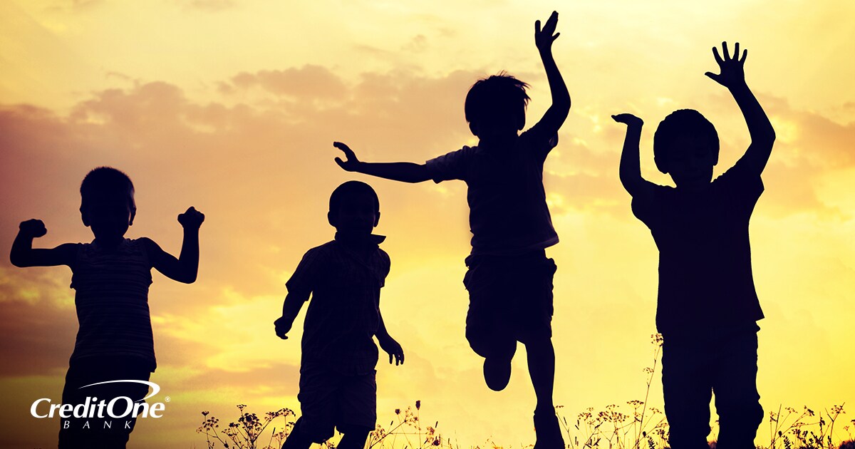 Silhouette of four young kids jumping with the sunset hitting them from behind Silhouette of four young kids jumping with the sunset hitting them from behind