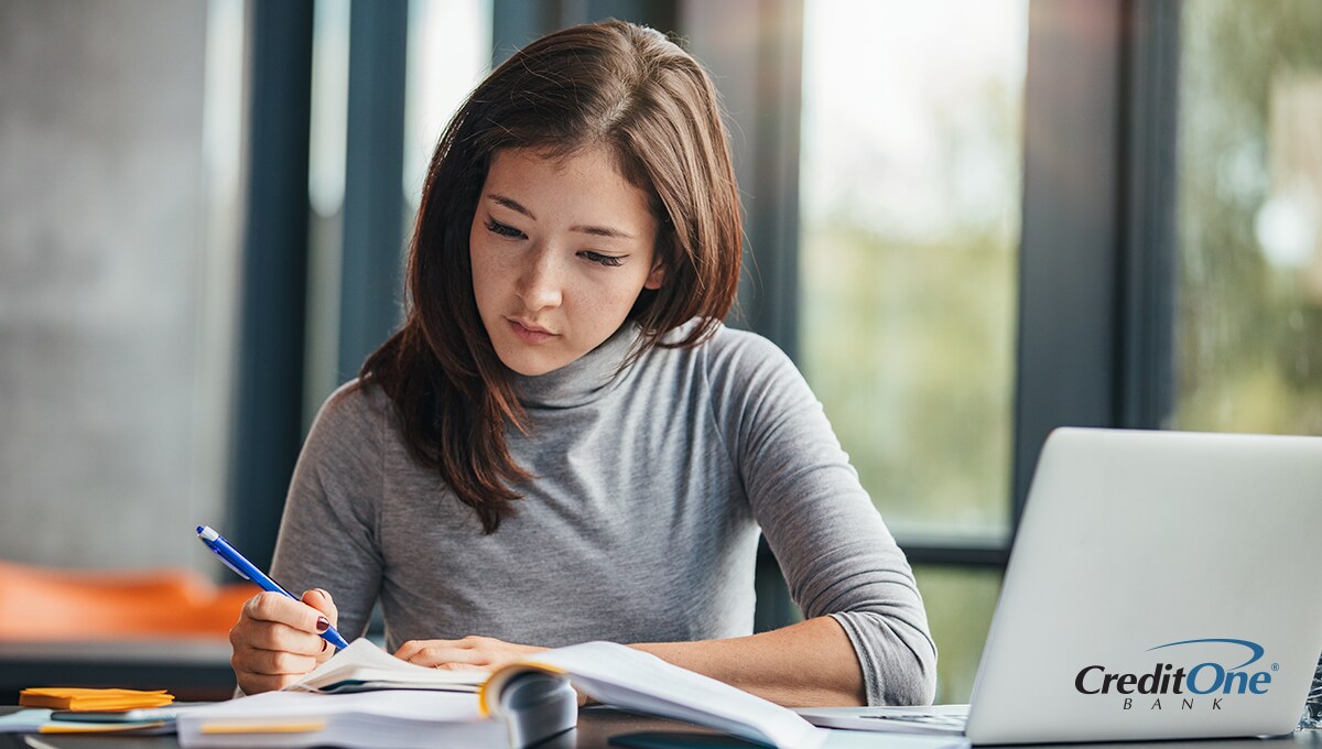 College student studying in the library College student studying in the library