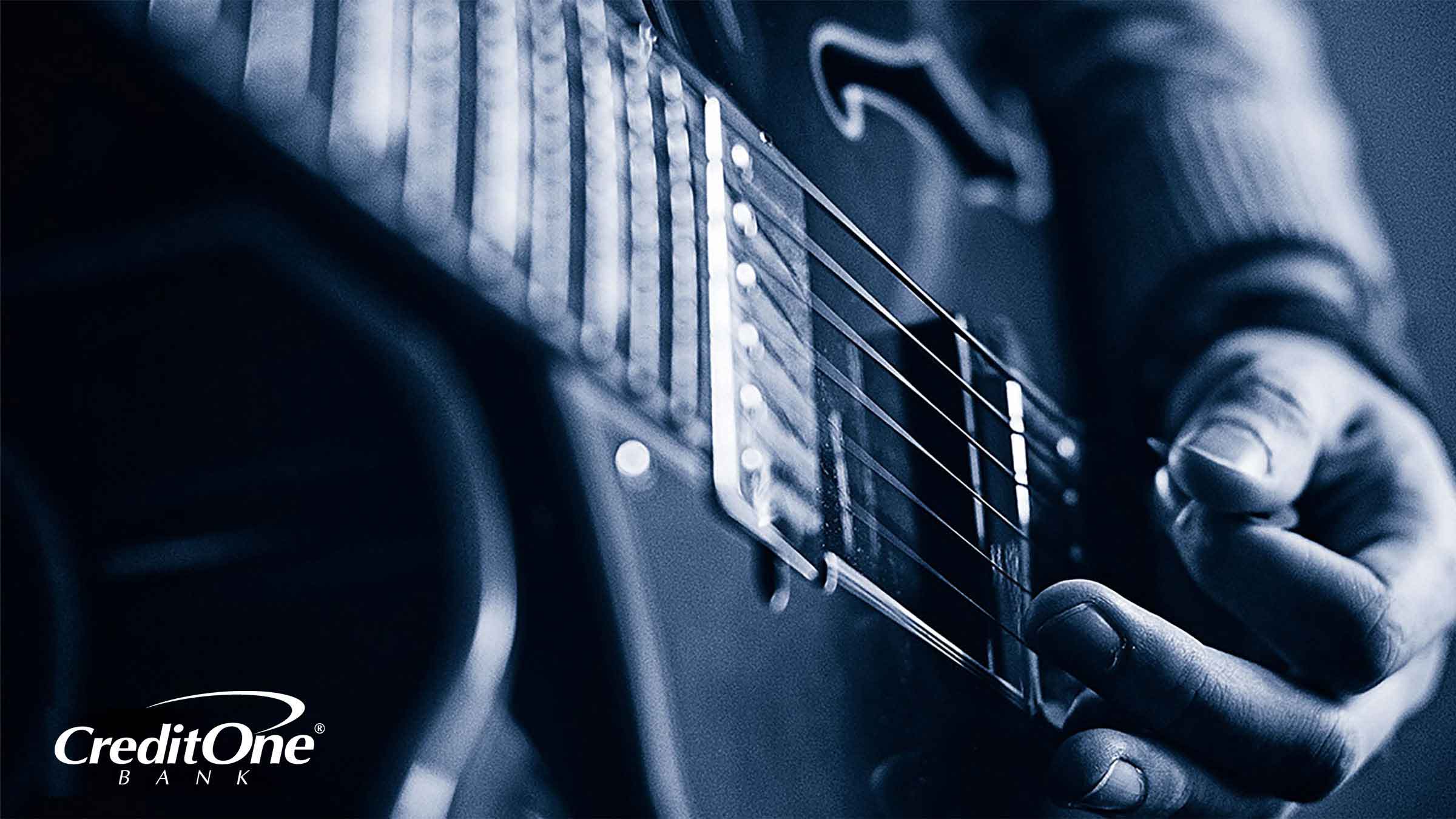 Closeup of a hand strumming a guitar Closeup of a hand strumming a guitar