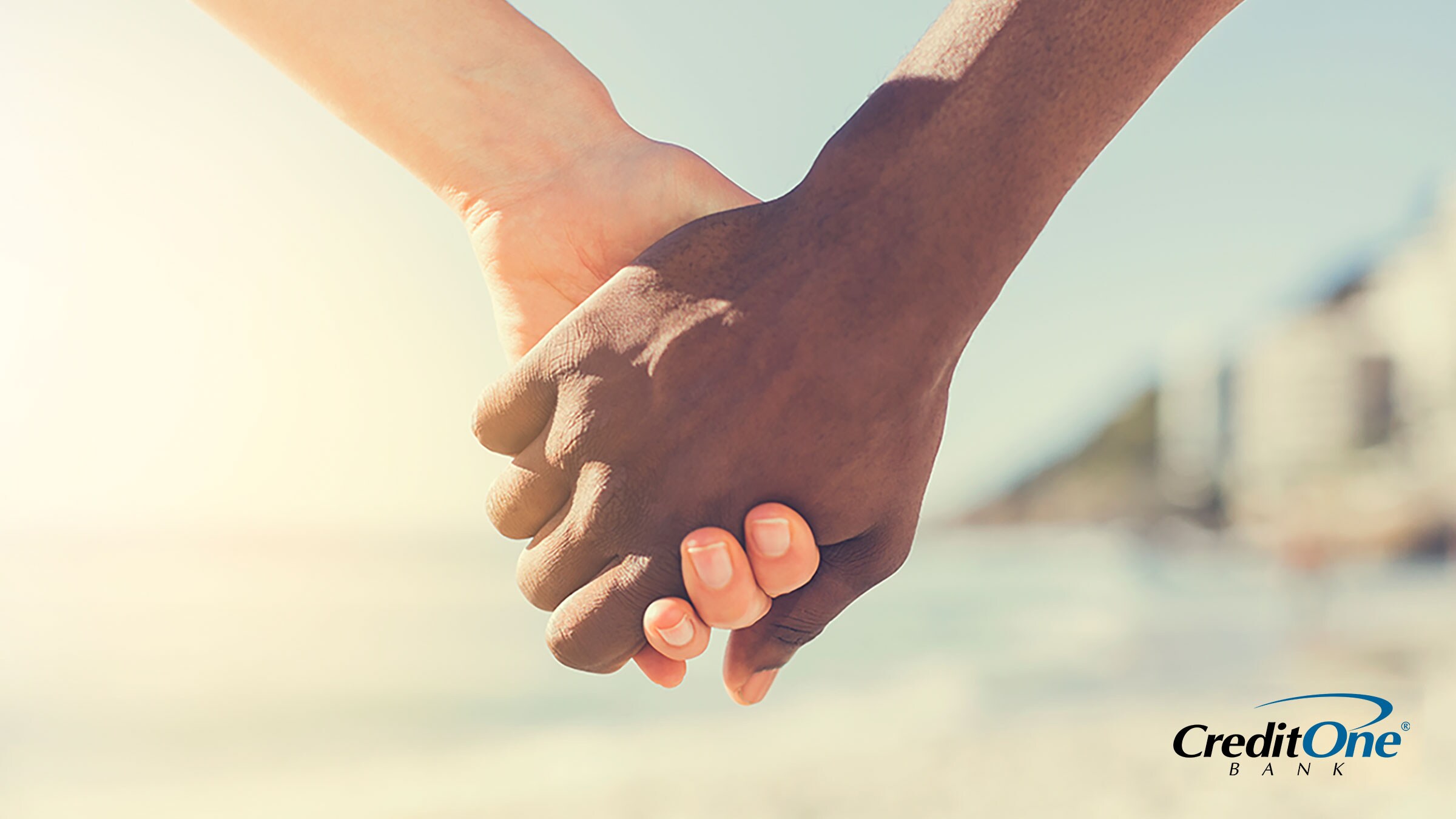 Two people holding hands demonstrating how income and credit come together Two people holding hands demonstrating how income and credit come together