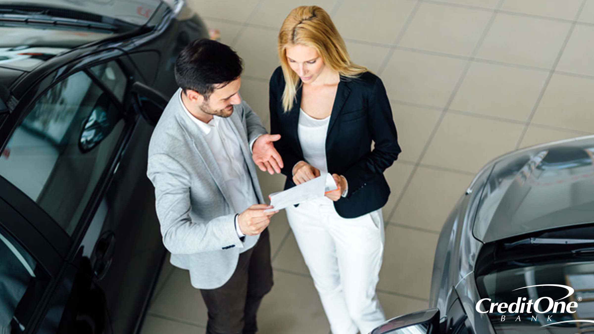 Weighing the options between leasing or buying a car at a car dealership Weighing the options between leasing or buying a car at a car dealership