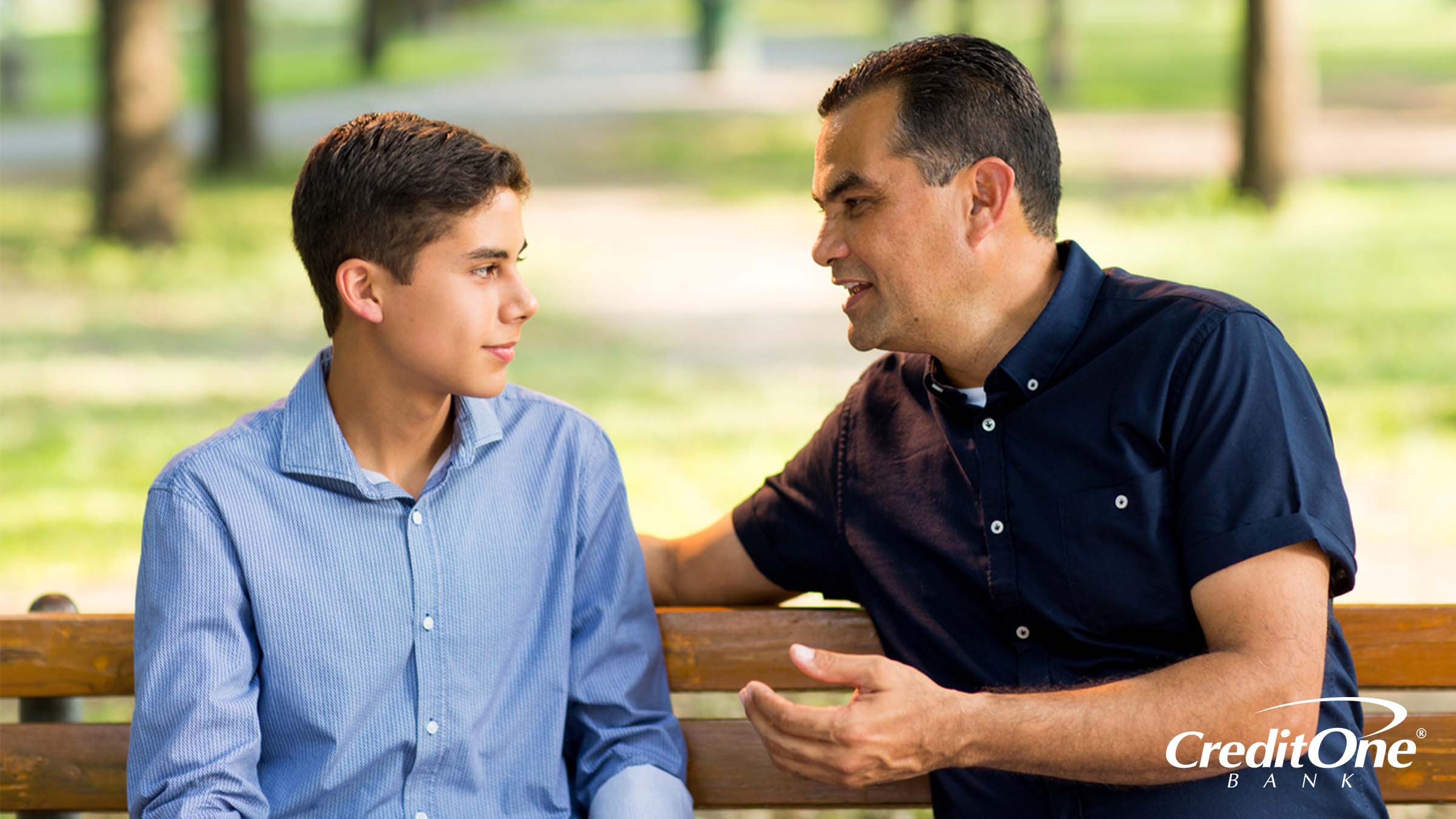 Father sharing financial advice with his son