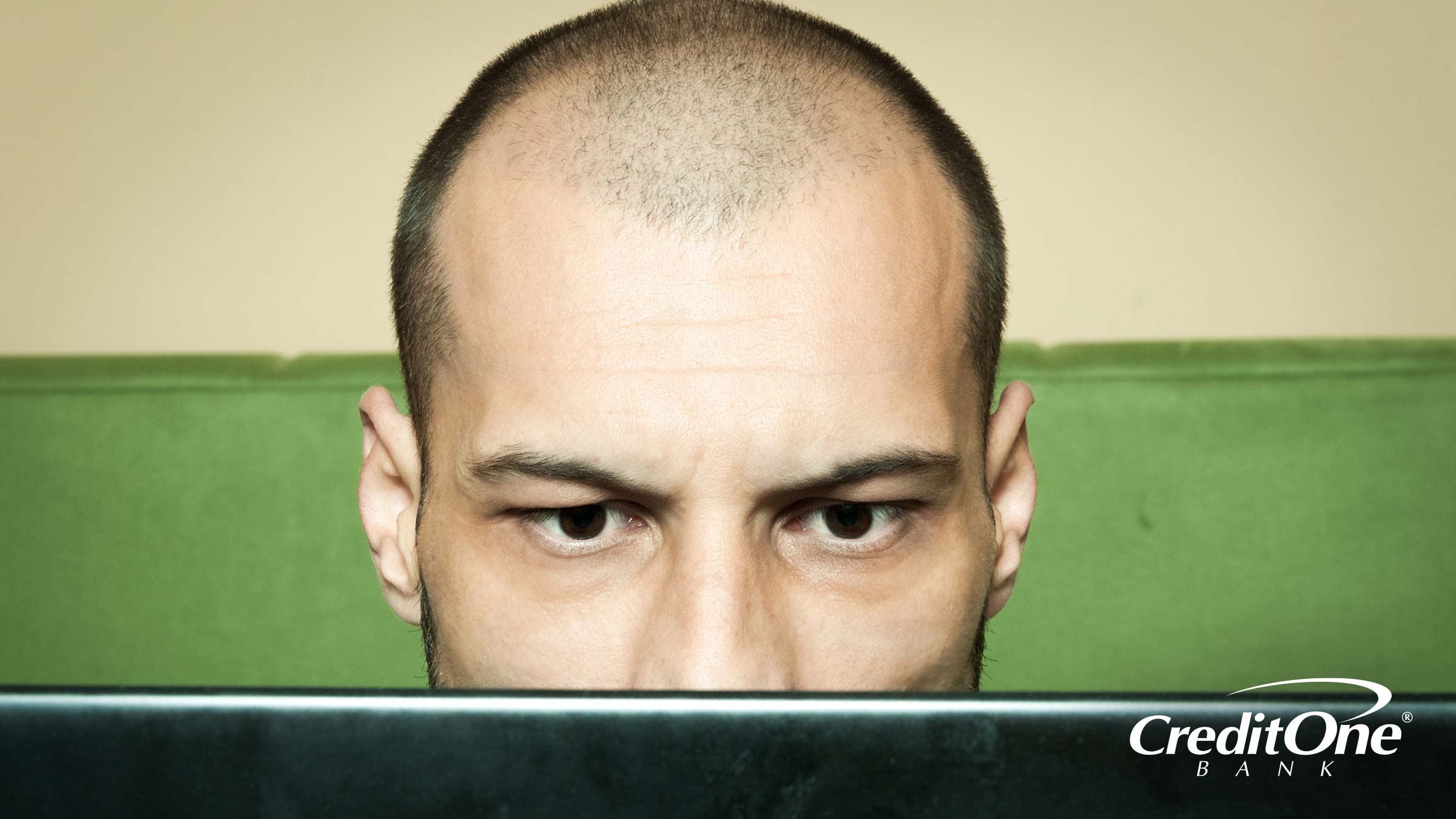 A Man Looking Intensely at His Laptop