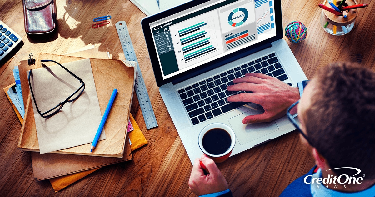 Small business owner checking his financial statements online Small business owner checking his financial statements online