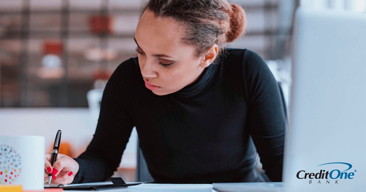 Woman itemizing her deductions before filing her taxes Woman itemizing her deductions before filing her taxes
